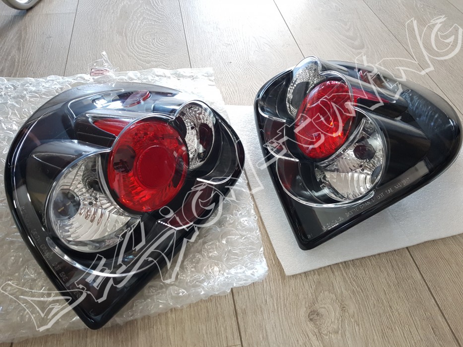 Чорні задні ліхтарі Chrysler Voyager, Dodge Caravan